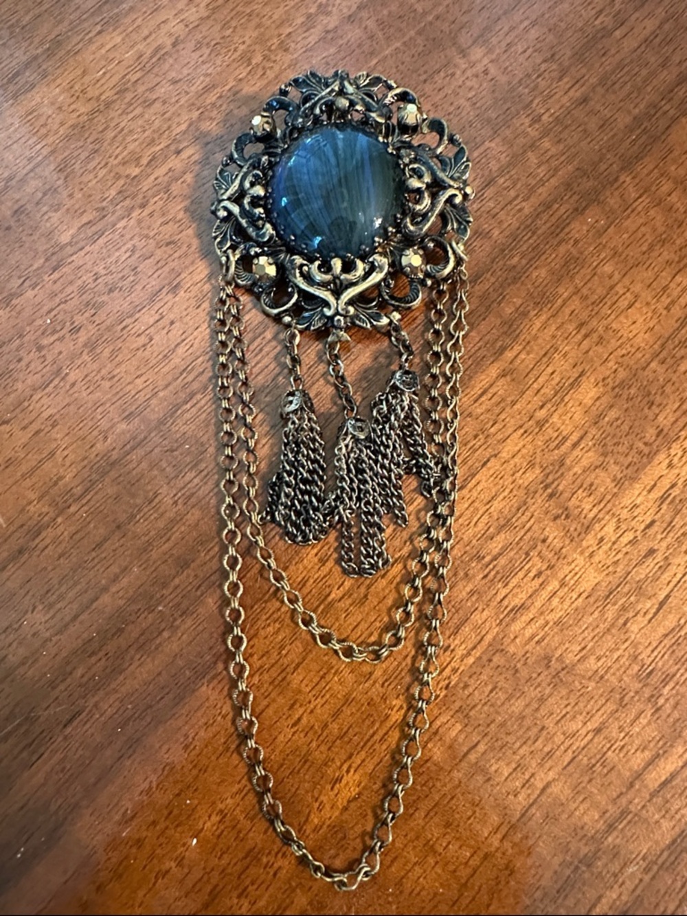 Antique-Style Gold-Tone Tassel Large Brooch with Dark Blue Stone